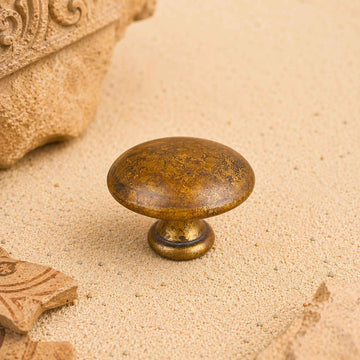 Bouton de meuble BOULE, finition laiton rouille
