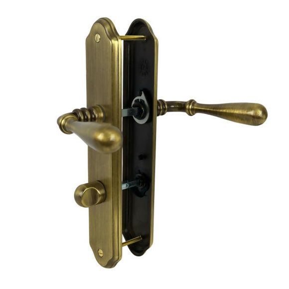 2 poignées de porte sur plaque CARINA, Verrou de condamnation pour salle de bain/WC, Finition laiton patiné, Entraxe standard 195 mm