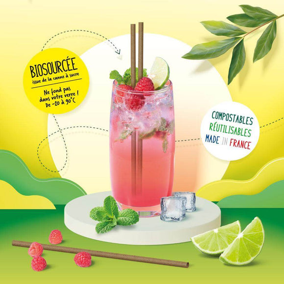 Cocktail with raspberry, lime, and eco-friendly sugarcane straws, highlighting made in France and compostable features.