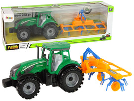 Tracteur vert avec entraînement par friction orange et bleu