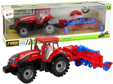 Tracteur rouge avec entraînement par friction de la charrue