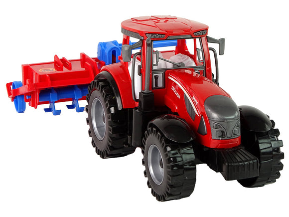 Tracteur rouge avec entraînement par friction de la charrue