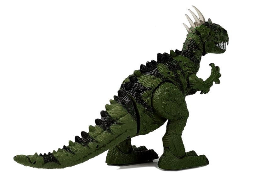Un dinosaure vert à piles se déplace avec le projecteur sonore
