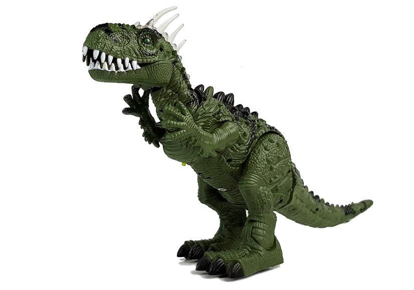 Un dinosaure vert à piles se déplace avec le projecteur sonore