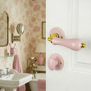 2 poignées sur rosaces rondes LIZON, Verrou de condamnation pour salle de bain/WC, Porcelaine rose, Finition coude en Laiton poli doré